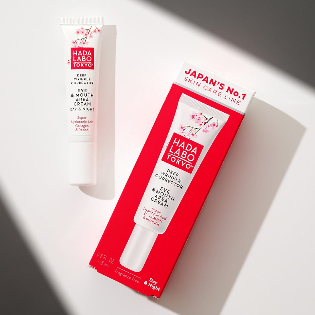 Hada Labo Deep Wrinkle Corrector Eye & Mouth Area Cream 15ml med tillhörande rödvit förpackning på ljus yta.